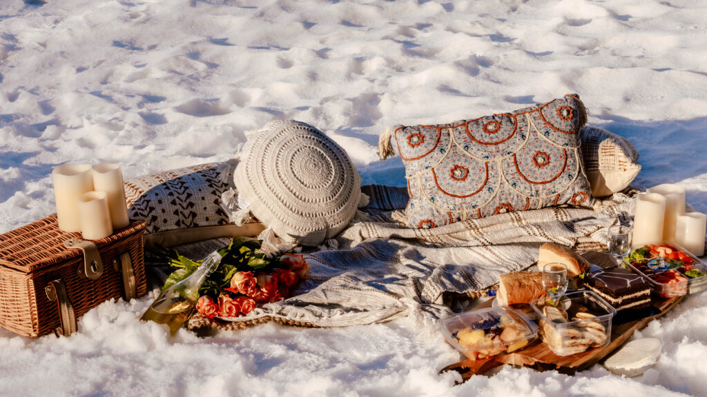 Glacier Park Surprise Engagement picnic. Beautiful picnic blankets and pillows set up for a proposal.