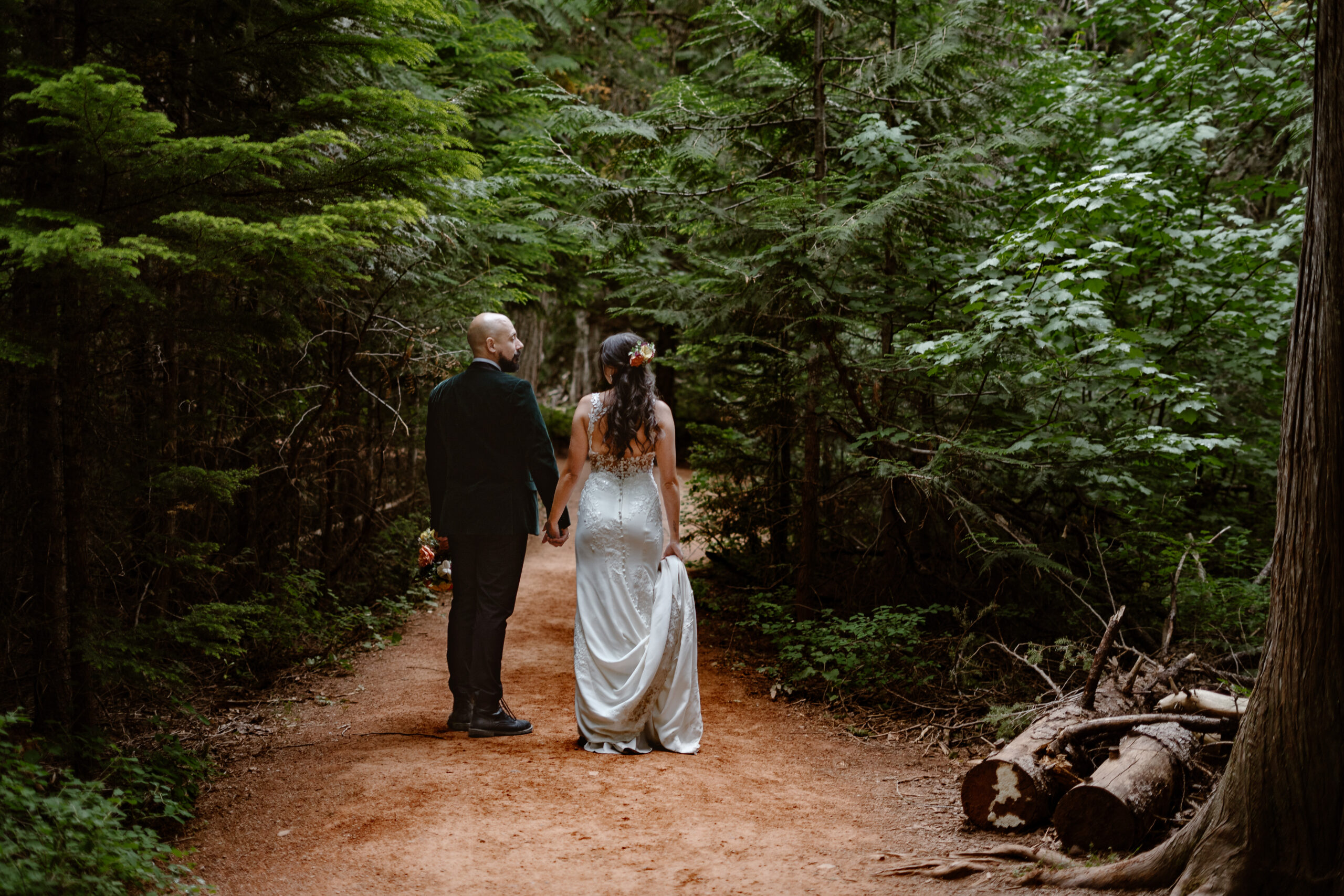 Elopement Photographer takes photo of couple eloping in glacier national park